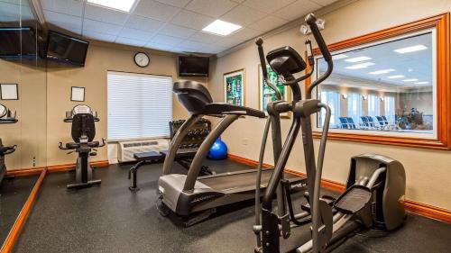 a gym with two exercise bikes and a treadmill at Comfort Inn & Suites in Waco