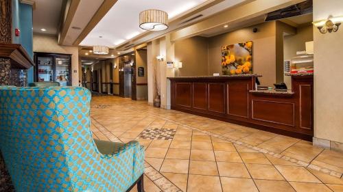 a lobby with a waiting room with a blue chair at Comfort Inn & Suites in Waco