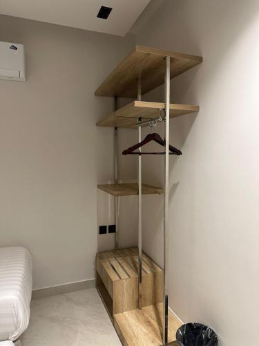 a room with wooden shelves on the wall at dana hotel apartments in Taif