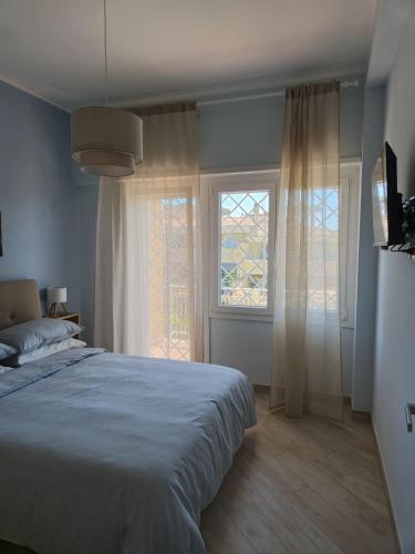 Ένα ή περισσότερα κρεβάτια σε δωμάτιο στο Villino Partenope