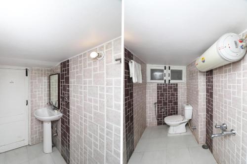 a bathroom with a toilet and a sink at Woodberry Inn & Suites By OYO Rome in Rome