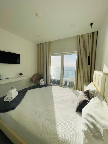 Ένα ή περισσότερα κρεβάτια σε δωμάτιο στο Beach Residence Mar do Norte