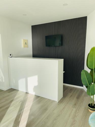 Μια τηλεόραση ή/και κέντρο ψυχαγωγίας στο Beach Residence Mar do Norte