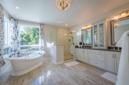 a large bathroom with a tub and a shower at Sycamore Ranch in Templeton