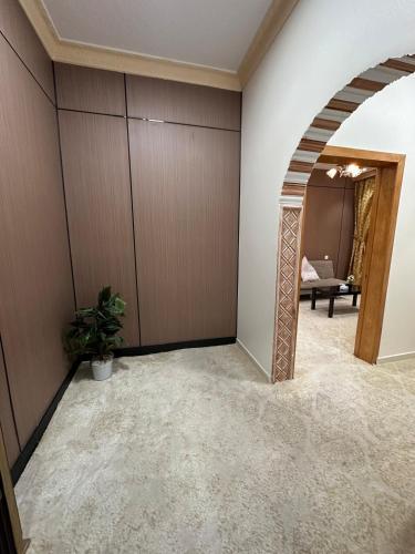 an empty room with a hallway with a table at ملاذ in Quai