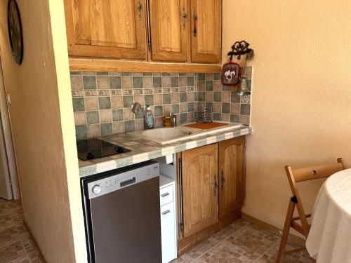 a small kitchen with a sink and a dishwasher at AL Cosy in Vars Ski & Nature in Vars