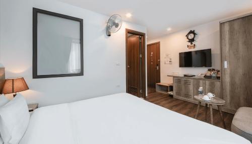 Postel nebo postele na pokoji v ubytování A25 Hotel - Hoàng Đạo Thúy 1
