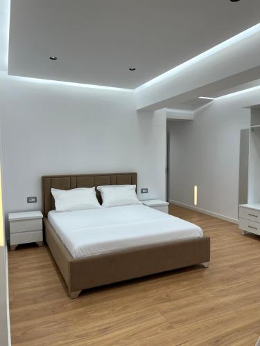 Ένα ή περισσότερα κρεβάτια σε δωμάτιο στο Poseidon Apartments