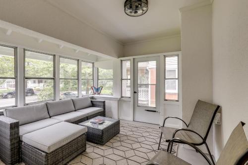 a living room with a couch and chairs and windows at 1 Mi to Beaches and Boardwalk Asbury Park Retreat in Asbury Park