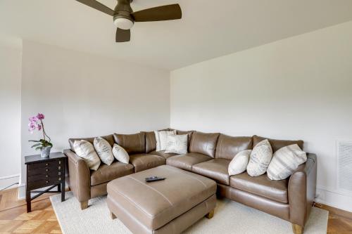 a living room with a brown leather couch at 1 Mi to Beaches and Boardwalk Asbury Park Retreat in Asbury Park