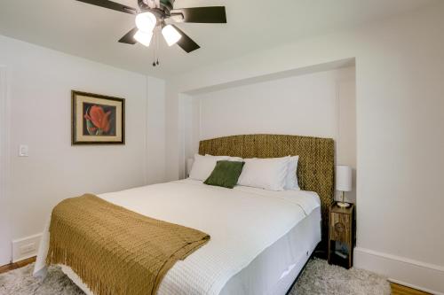 a bedroom with a white bed with a ceiling fan at 1 Mi to Beaches and Boardwalk Asbury Park Retreat in Asbury Park