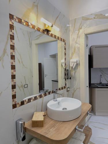 a bathroom with a sink and a mirror at AuRoom in Naples