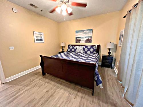 a bedroom with a bed and a ceiling fan at Laguna Breeze in Gulf Shores