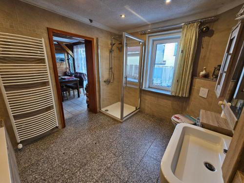 a bathroom with a shower and a sink at Thüringer Landhaus in Gehlberg