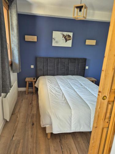 En eller flere senge i et værelse på vacance familiale à la montagne