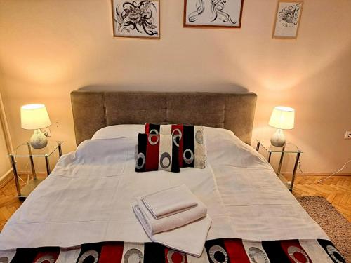 a bed with three pairs of scissors on it at Parrag Panzió Mátraszentimre in Mátraszentimre
