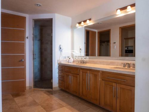 a bathroom with a double sink and a shower at Playa Blanca Premier Unit 1410 in San Carlos