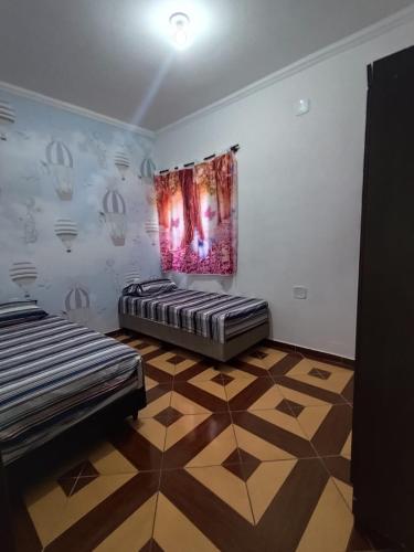 Postel nebo postele na pokoji v ubytování Recanto do Gugu