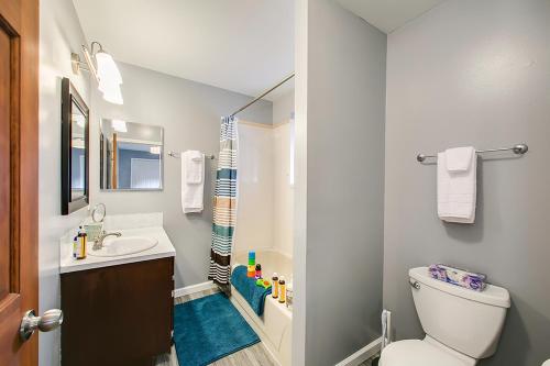 a bathroom with a toilet and a sink and a shower at Hyde Park Home in Boise