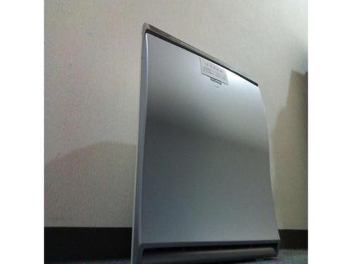 a stainless steel refrigerator with a sticker on it at Smile Hotel Hirosaki - Vacation STAY 40509v in Hirosaki