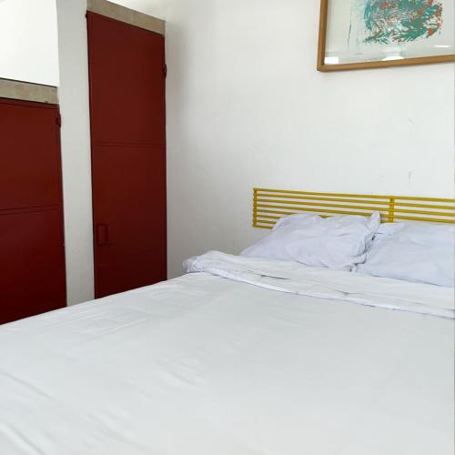 Katil atau katil-katil dalam bilik di INMOTEGA - Suites TG