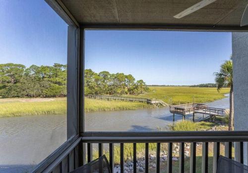 a view of a river from a house window at 174 Beach Club Villa in Fripp Island