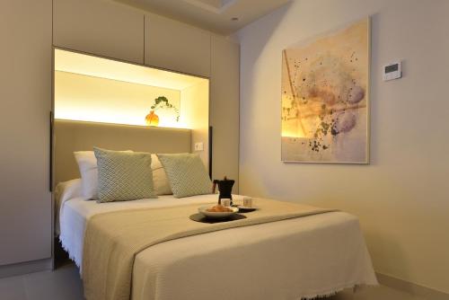 a bedroom with a bed with a bowl on it at LA CALA TROCADERo in Cala del Moral