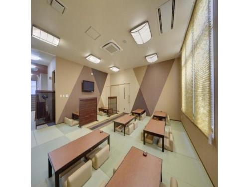 a classroom with desks and tables in a room at Quad Inn Yokote - Vacation STAY 59863v in Yokote
