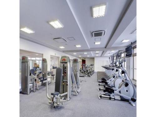 a gym with rows of treadmills and machines at Quad Inn Yokote - Vacation STAY 59868v in Yokote
