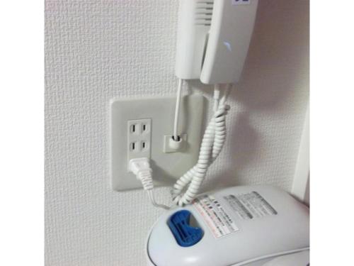 a phone is plugged into a socket in a wall at Quad Inn Yokote - Vacation STAY 57389v in Yokote
