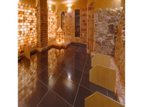 a room with a stone wall and a tile floor at Quad Inn Yokote - Vacation STAY 57389v in Yokote