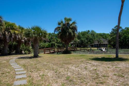 a path in a park with palm trees at 364 Wahoo Dr in Fripp Island