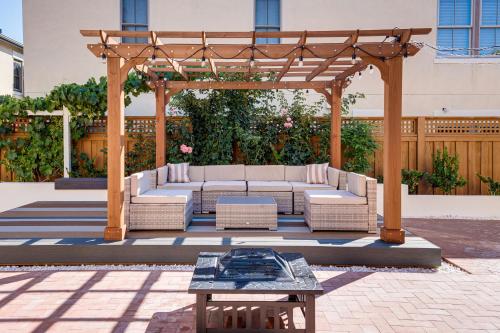 a pergola with a couch and chairs and a table at Luxe Bay View Home Near SF, Berkley and Napa Valley in Hercules