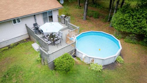 an overhead view of a large swimming pool on a house at Petals Suite Patio Nature Trails Bancroft in Bancroft