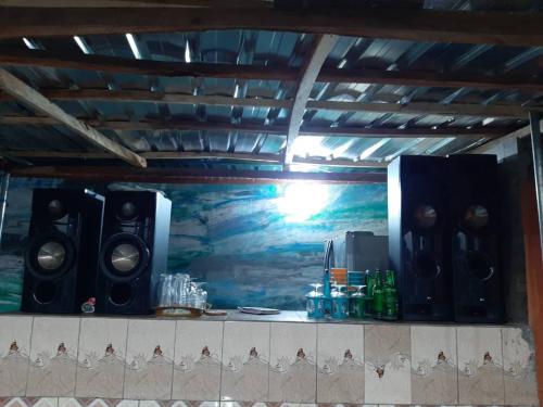a room with a wall with a painting on it at Pasasa Hotel & Event Centre in Lafenwa