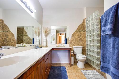 a bathroom with a sink toilet and a mirror at Southern #2068 Mesa in Mesa