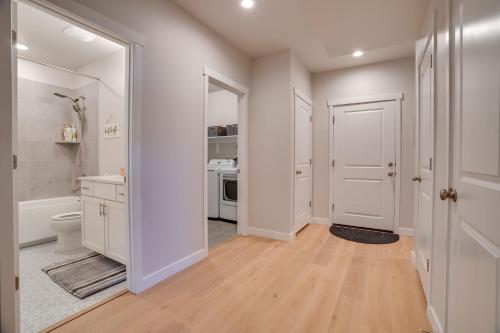 a white bathroom with a toilet and a sink at Heber Retreat by Xquisite Rentals in Heber City