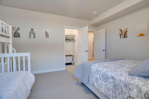 a white bedroom with two beds and a staircase at Heber Retreat by Xquisite Rentals in Heber City