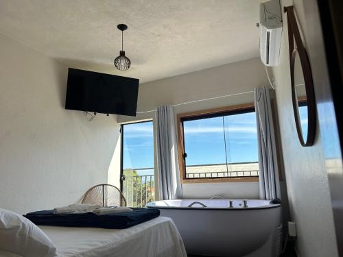 Ένα ή περισσότερα κρεβάτια σε δωμάτιο στο Hotel dos Sonhos