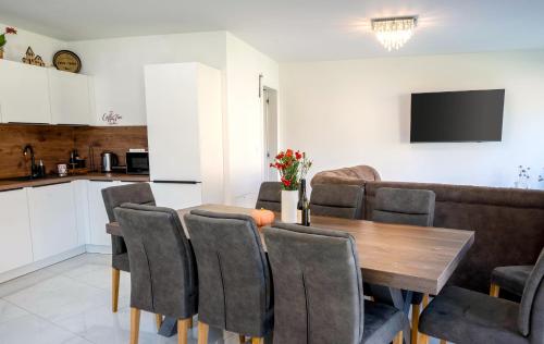 a kitchen and a dining room with a table and chairs at 4 Bedroom Private House On The Hill in Ljubljana