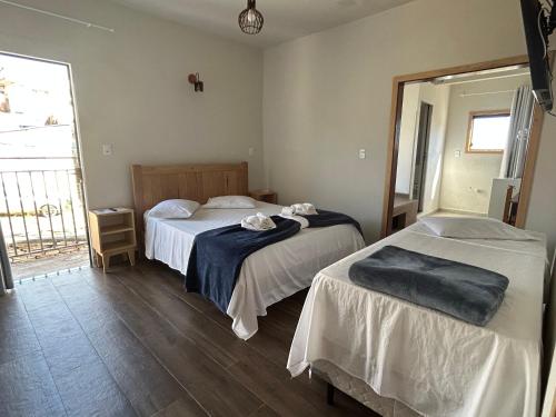 Ένα ή περισσότερα κρεβάτια σε δωμάτιο στο Hotel dos Sonhos