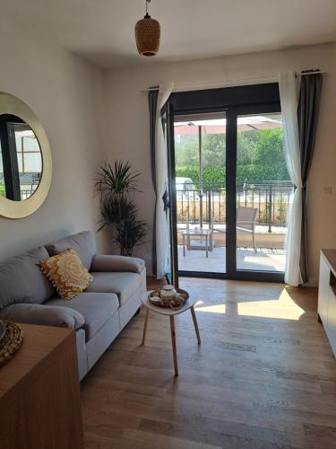 a living room with a couch and a table at Vuti in Bijela