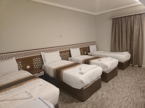 Postelja oz. postelje v sobi nastanitve فندق كنوز العنود مكة للغرف والشقق المفروشة توصيل مجاني للحرم - Knoz Al Anood Hotel Makkah For Furnished Rooms and Apartments Free Shuttle Service