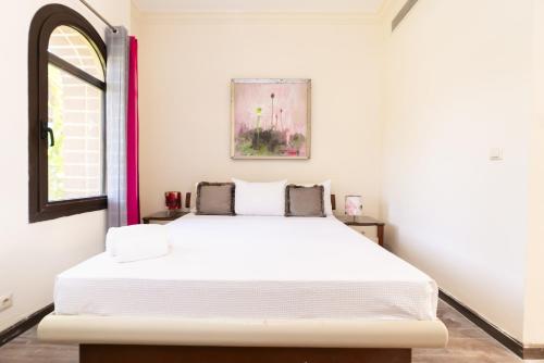 A bed or beds in a room at MARASSI VERONA VILLA by ELEGANT Hospitality