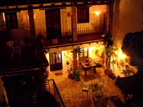 an overhead view of a courtyard of a building at night at Posada La Casa Grande in Jimena de la Frontera
