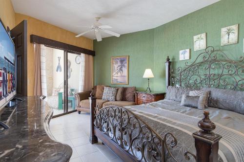 a bedroom with a large bed and a couch at Sonoran Sea in Campo del Medio