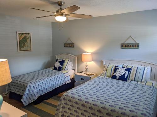 Postel nebo postele na pokoji v ubytování 143 Capt John Fripp Villa