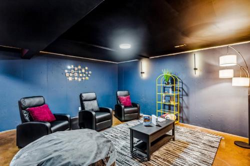 a room with chairs and a bed and a table at Theater, King&PoolTable with PrivateHotTub in The Dell