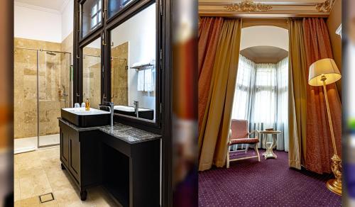 a bathroom with a sink and a mirror at Heritage Boutique Hotel Sighisoara in Sighişoara
