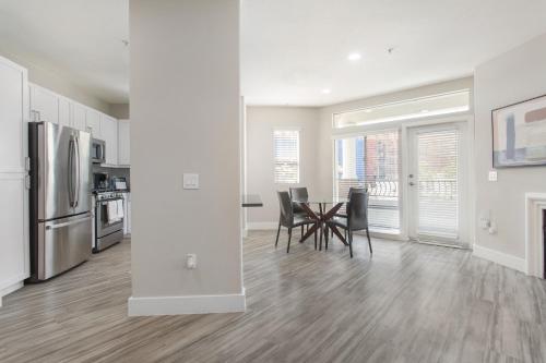 a kitchen and dining room with a table and chairs at Multiple Hollywood Apartments Hub in Los Angeles